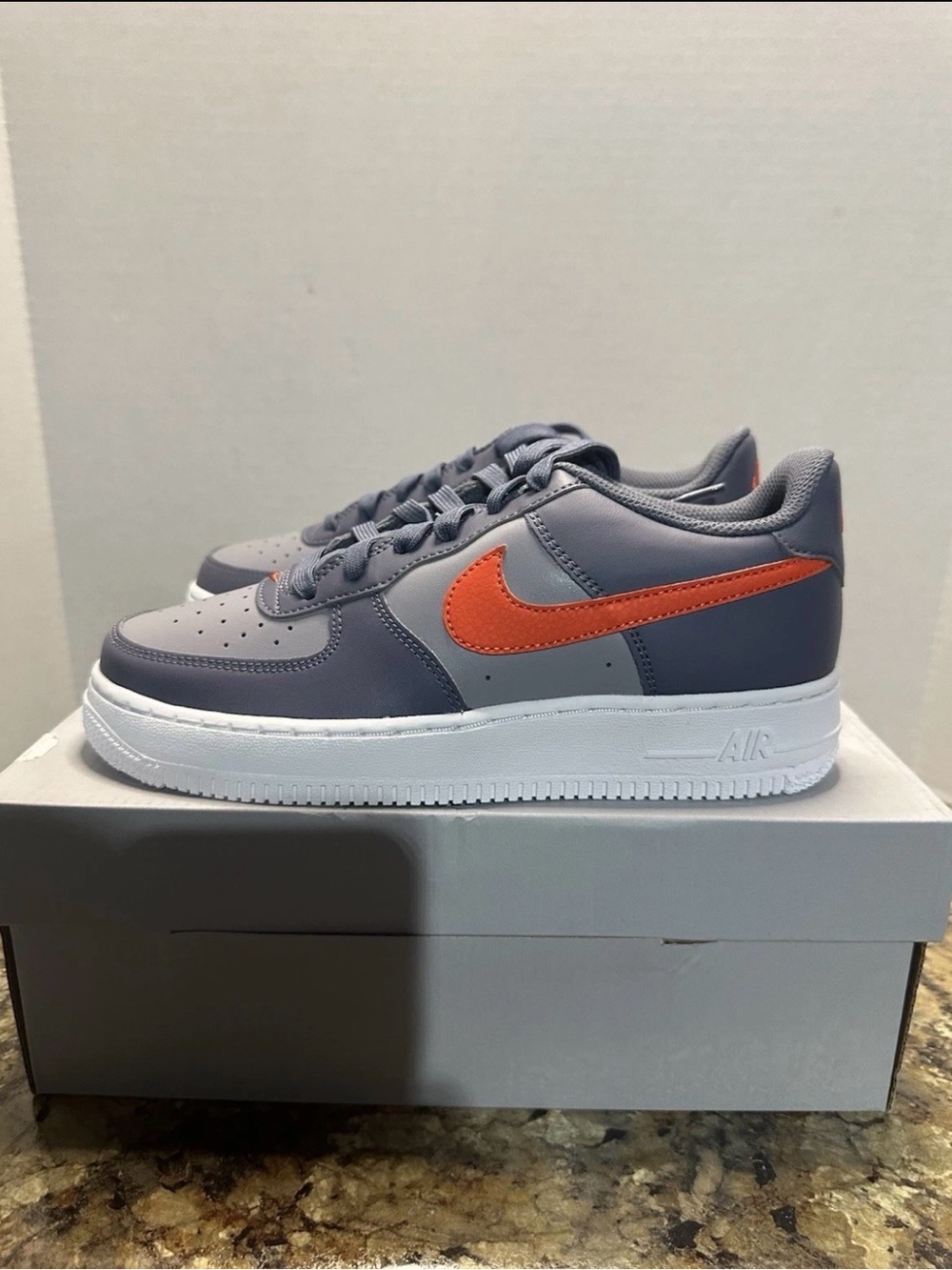 Nike Low-Top Sneakers in Gray with Orange Swoosh
